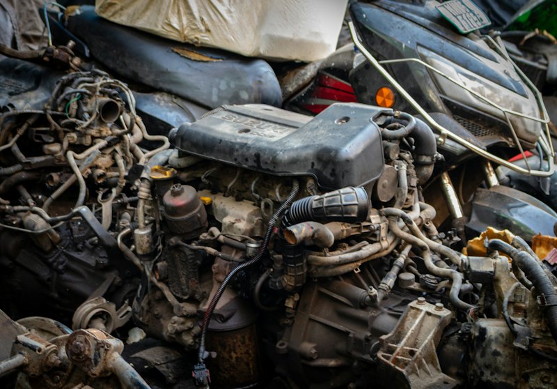 A pile of used engines and vehicle parts